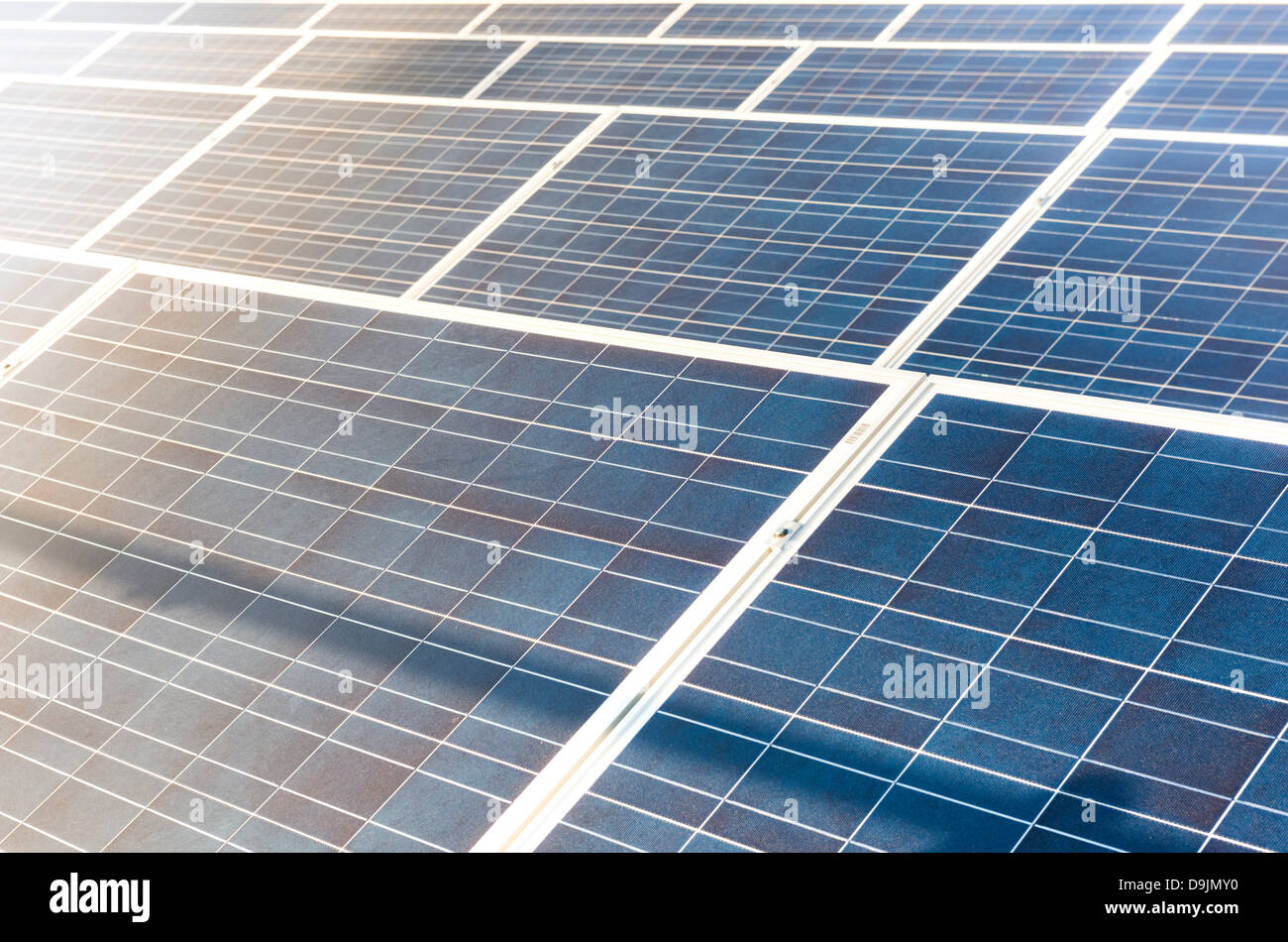 Photovoltaic solar panels on a factory roof. Stock Photo
