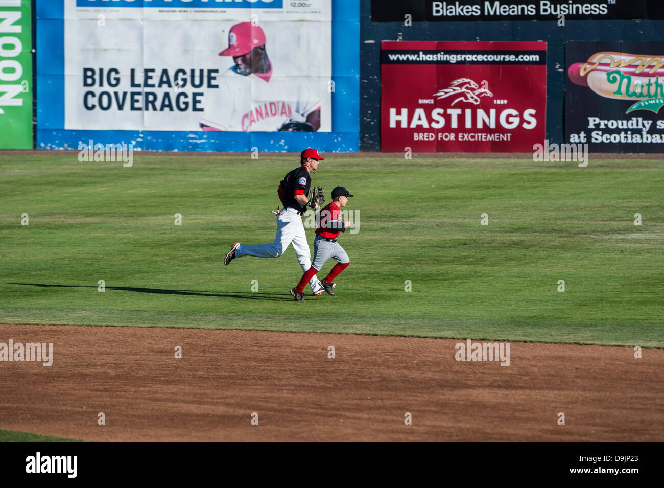 Vancouver , British Columbia, Canada. June 18 2013 . Player buddies pre game start at seasons second home game between Vancouver Canadians and Spokane Indians at Scotiabank Field at Nat Bailey Stadium Vancouver , British Columbia Canada on June 18 2013 . Photographer Frank Pali/Alamy Live News Stock Photo