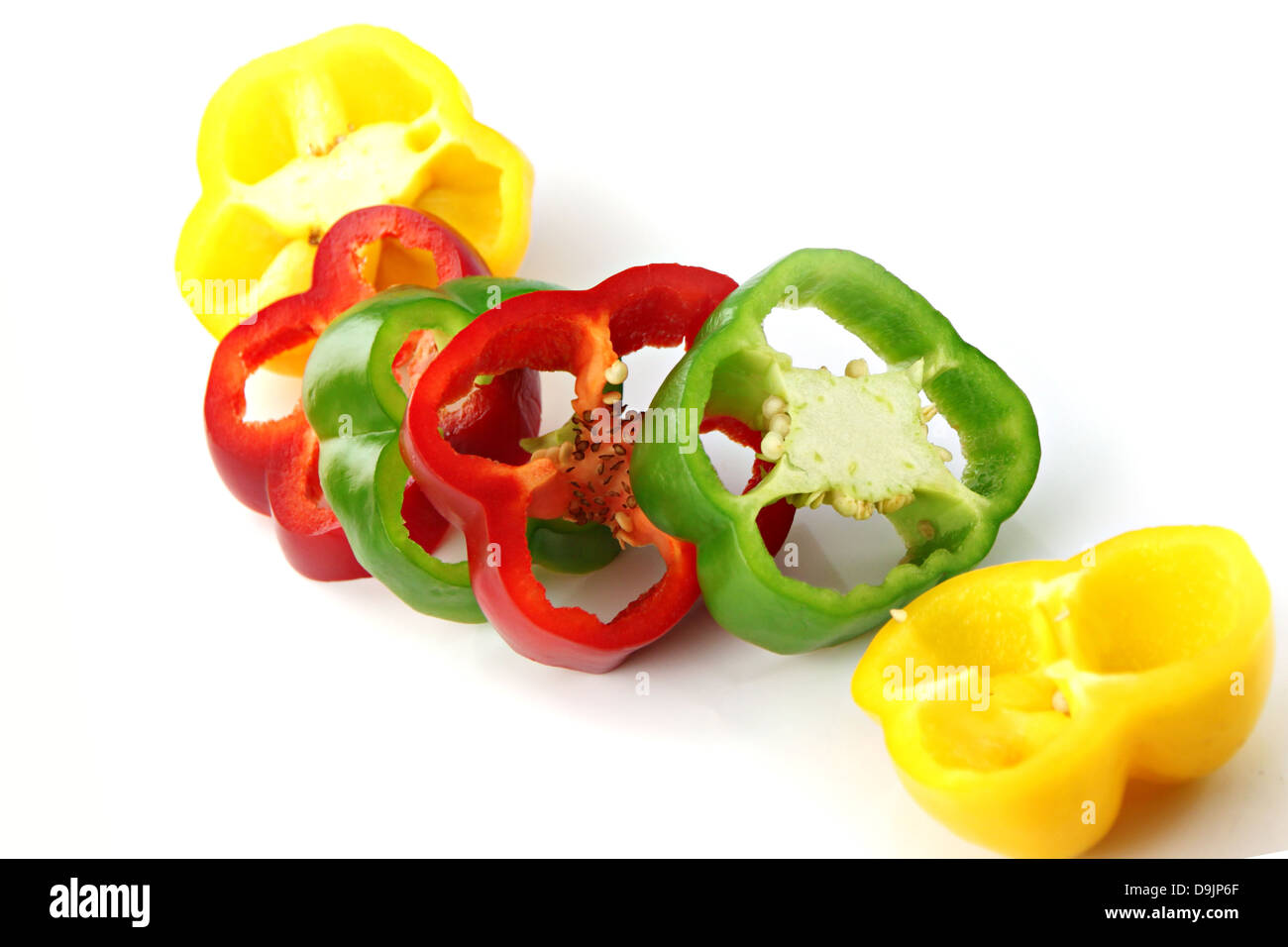 Slice the Three color of bell pepper on the white background. Stock Photo