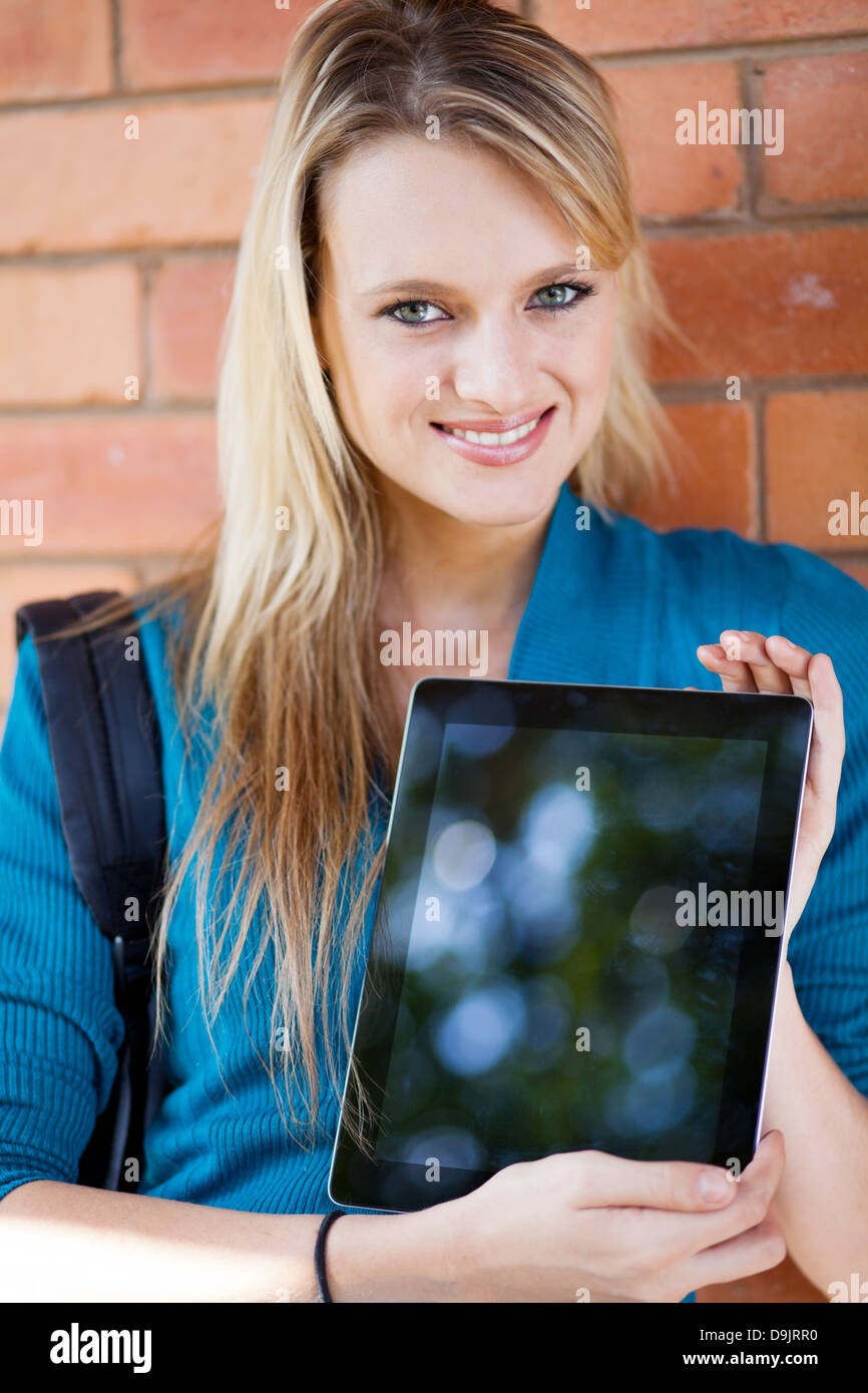 pretty female college student presenting tablet computer Stock Photo