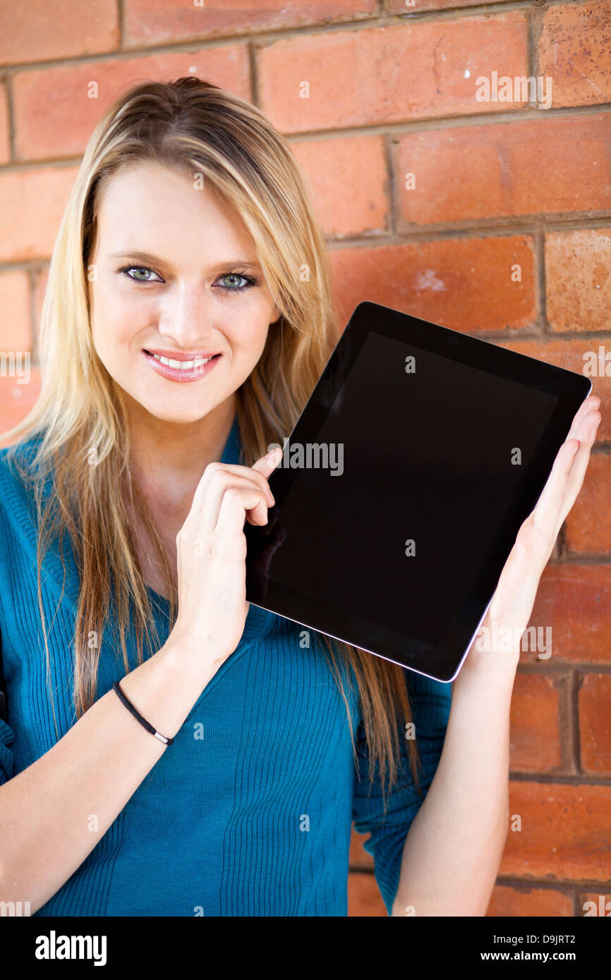 beautiful female college student presenting tablet computer Stock Photo