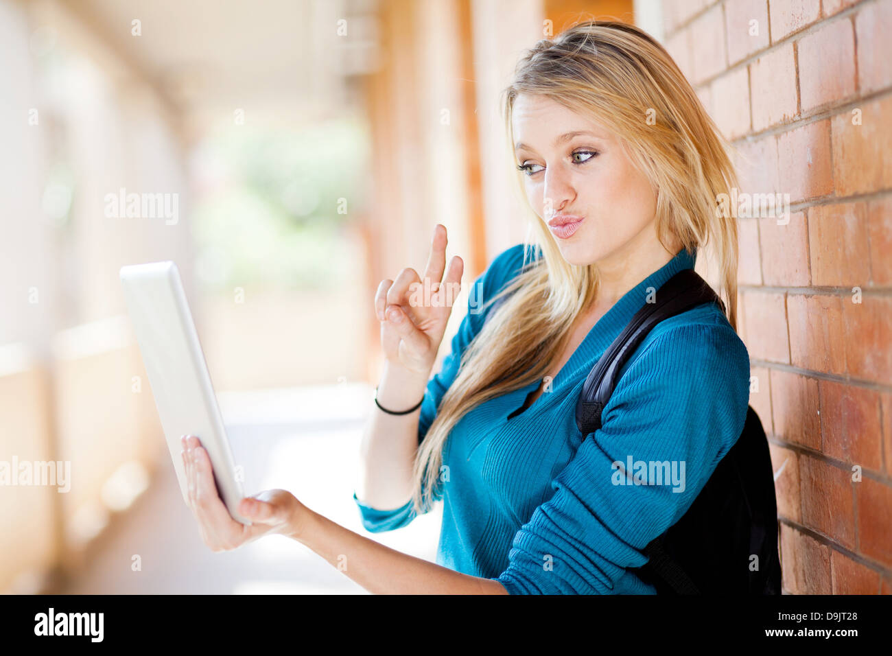 cute female college student using tablet computer communicate with friends Stock Photo