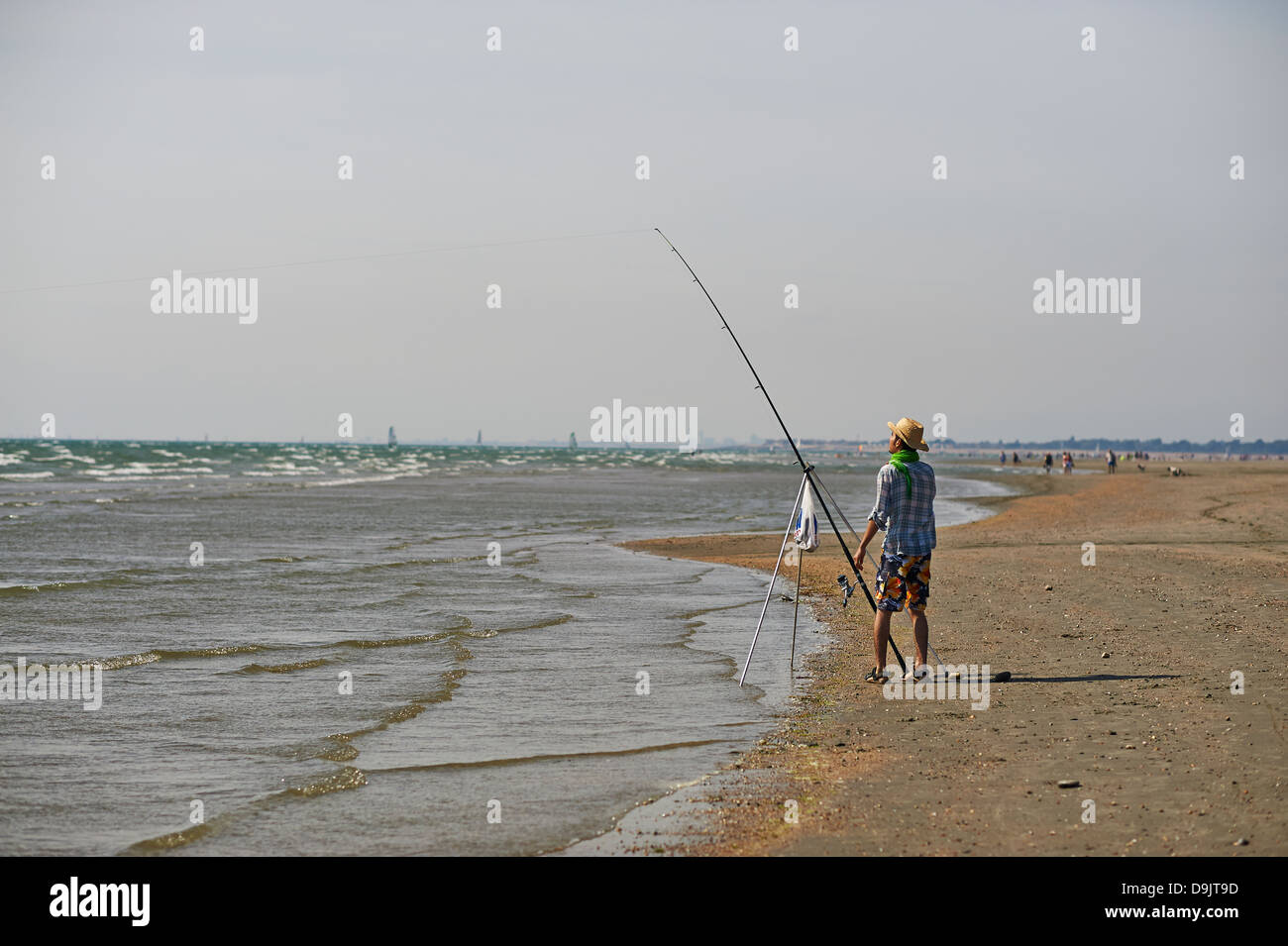 fishing off the beach Stock Photo Alamy