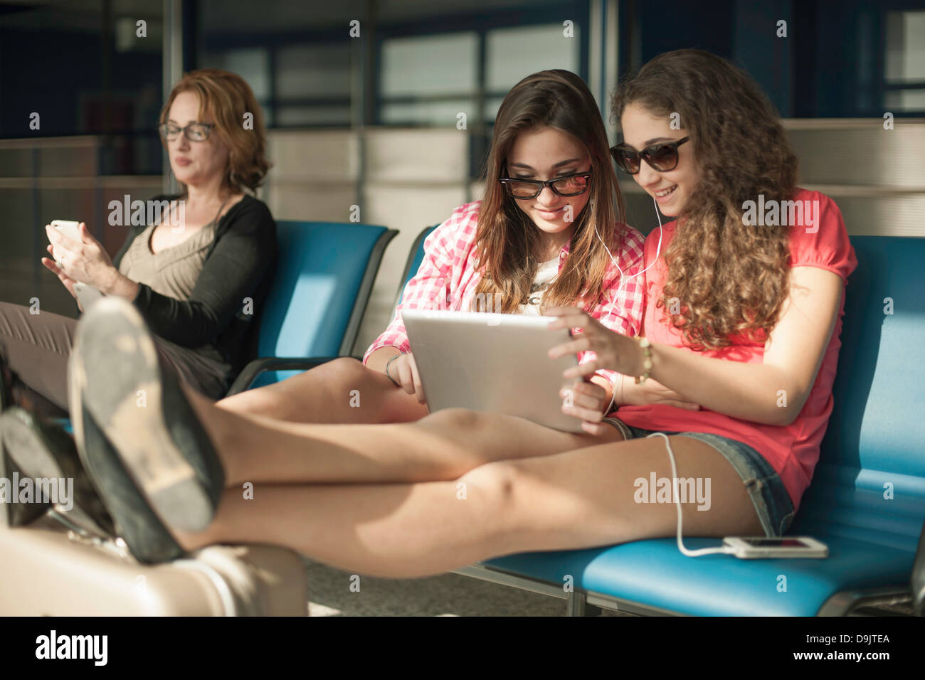 Teenage girls using digital tablet Stock Photo