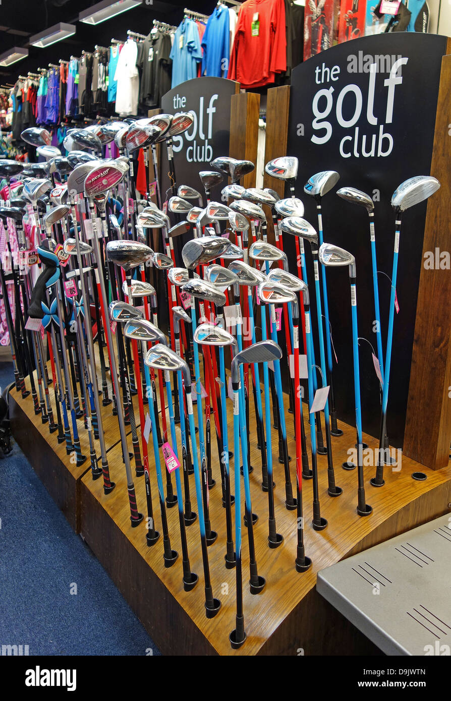 Golf clubs for sale in a sporting goods store, uk Stock Photo