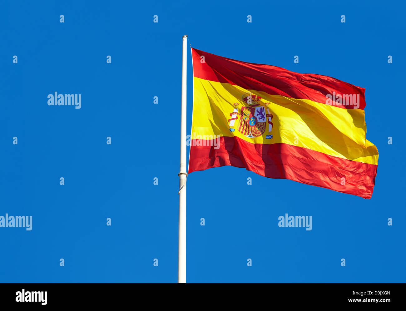 Spanish flag at Colon square. Madrid. Spain Stock Photo