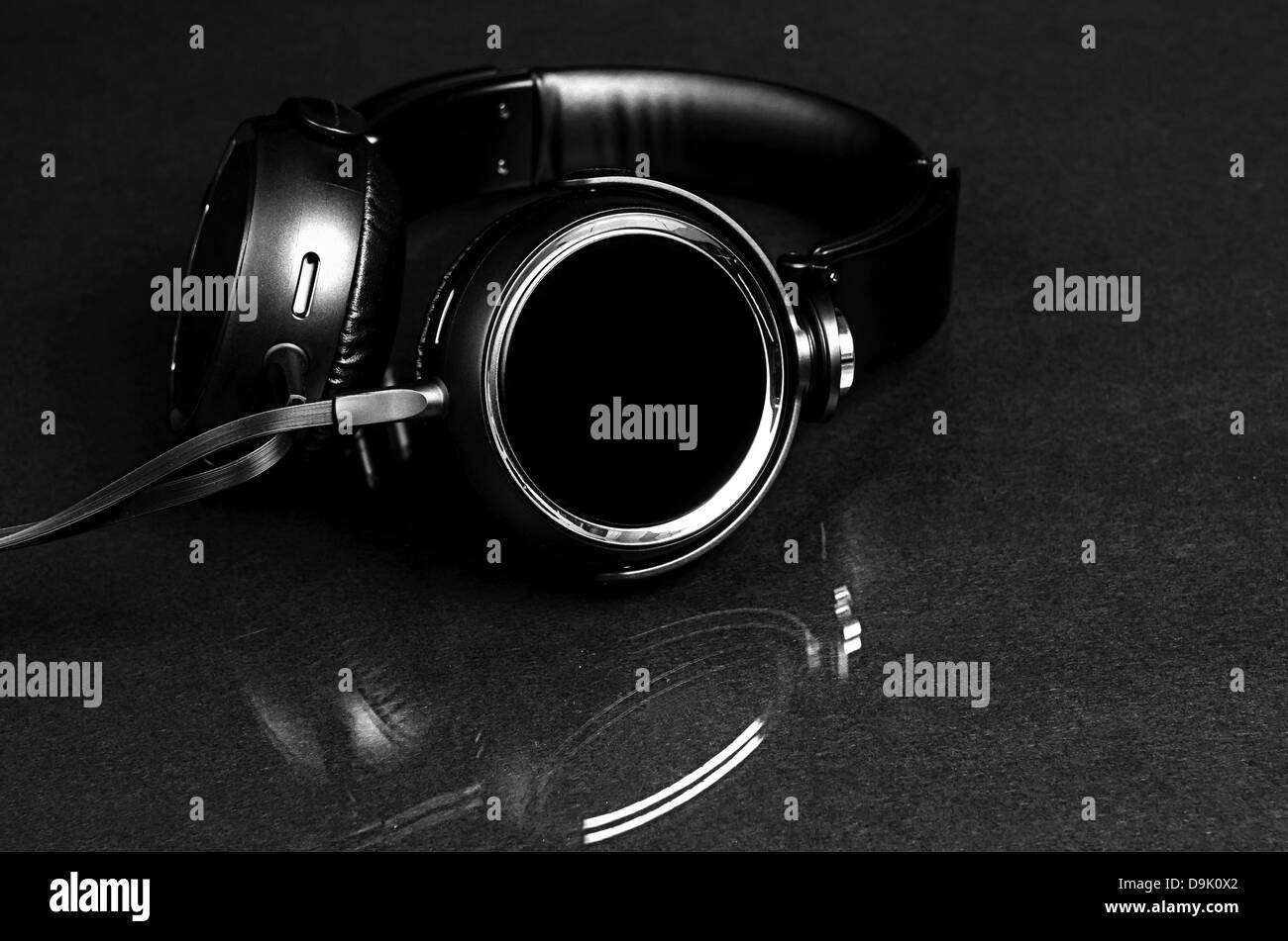 A pair of black headphones with reflection Stock Photo