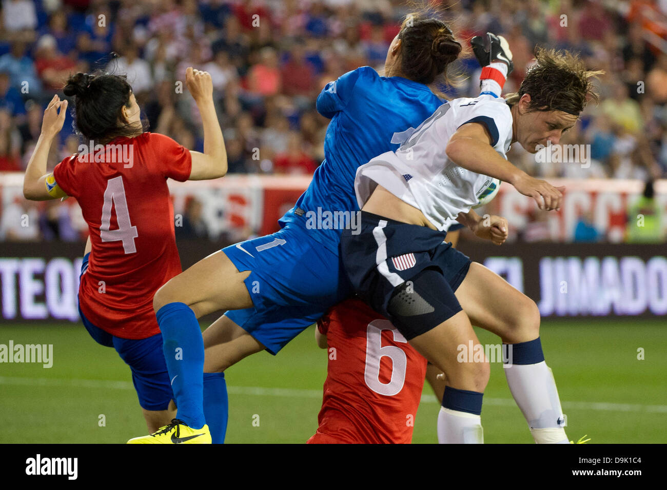 June 20, 2013 - Harrison, N.J, U.S - June 20, 2013: US Women's National Team forward Abby Wambach (20) collides with Korea Republic goalkeeper Kim Jungmi (1) during the U.S. Women vs. Korean Republic- International Friendly at Red Bull Arena - Harrison, N.J. The US Women's National Team defeated The Korea Republic 5-0. Stock Photo