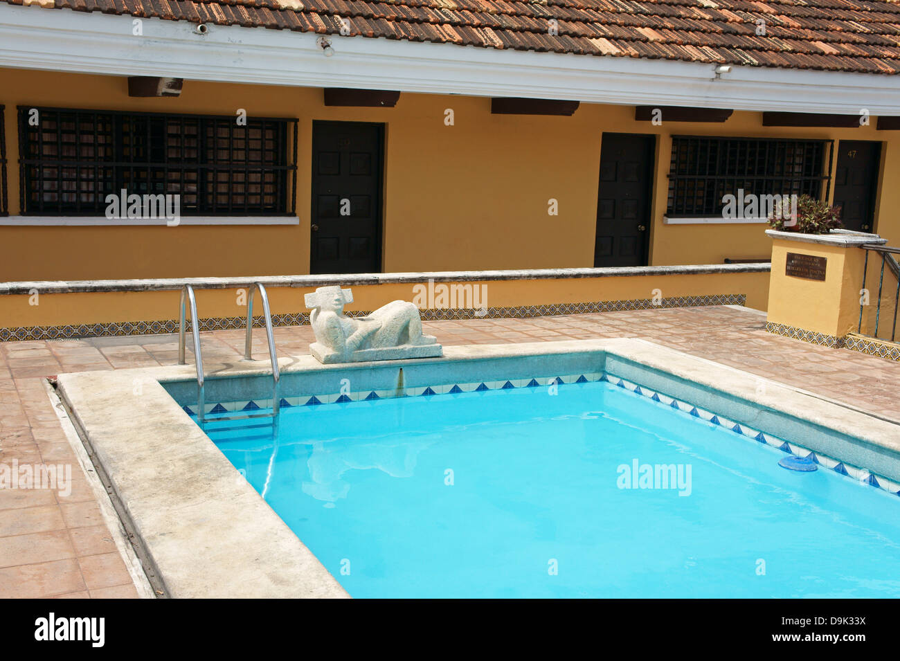 Mayan Chacmool sculpture and rooftop swimming pool at the Hotel Caribe, Merida, Yucatan, Mexico Stock Photo