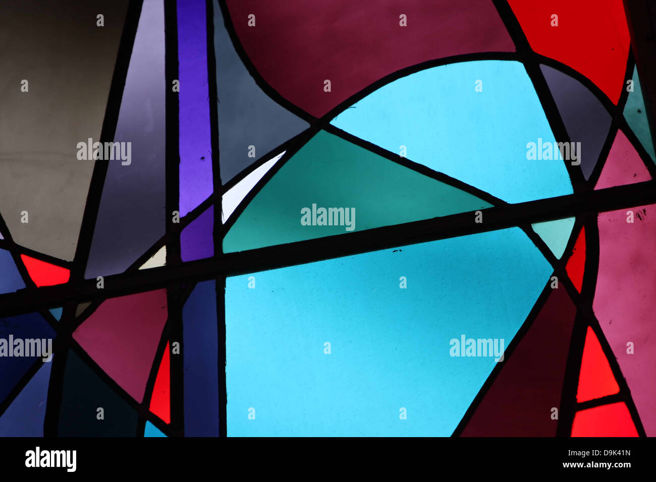 stained glass window red green gray grey purple lines black lighting macro closeup Stock Photo