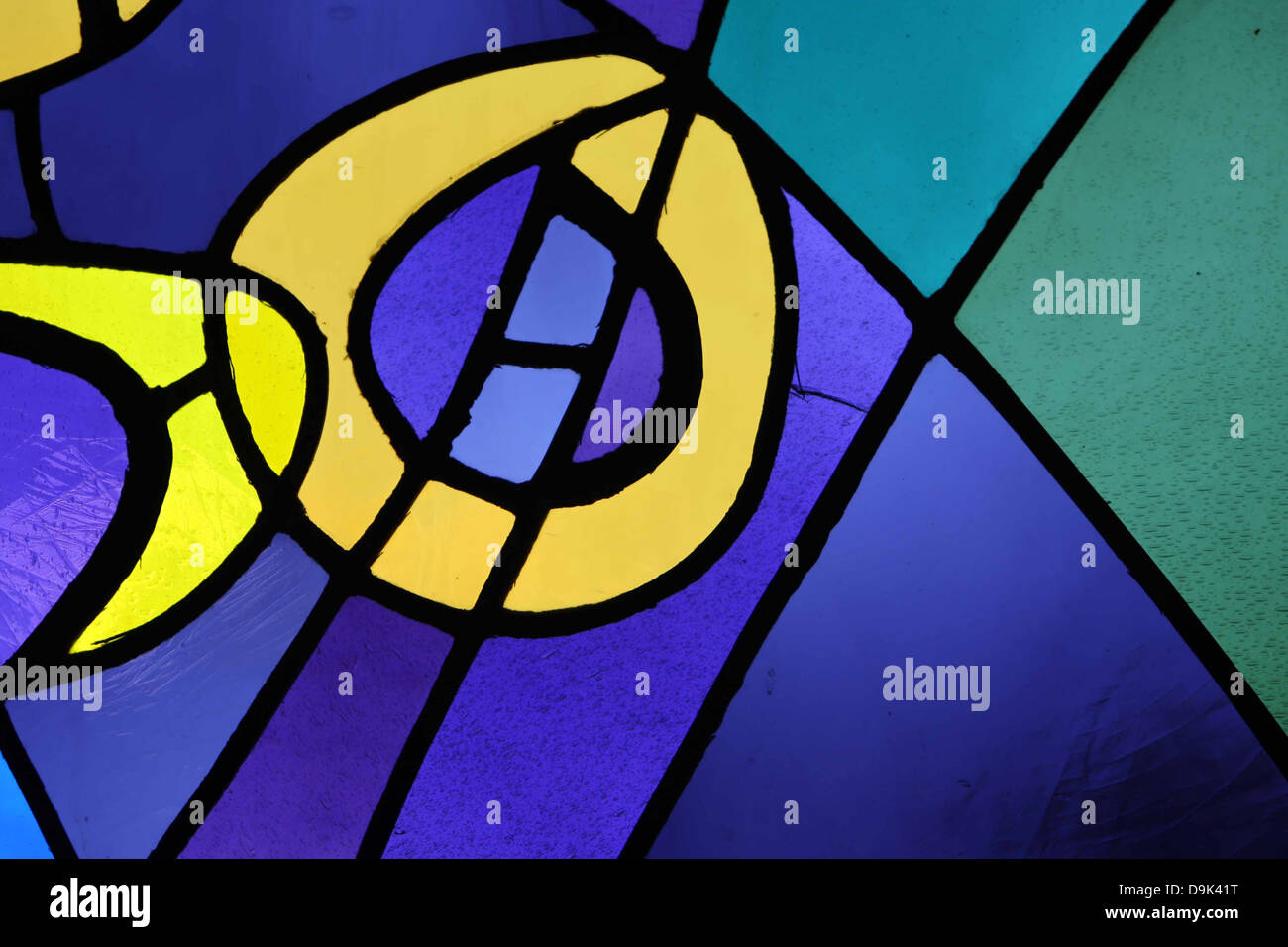 stained glass window blue yellow green purple lines black lighting