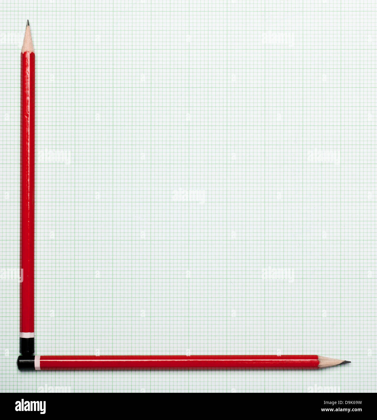 Blank graph paper with pencils as axis Stock Photo