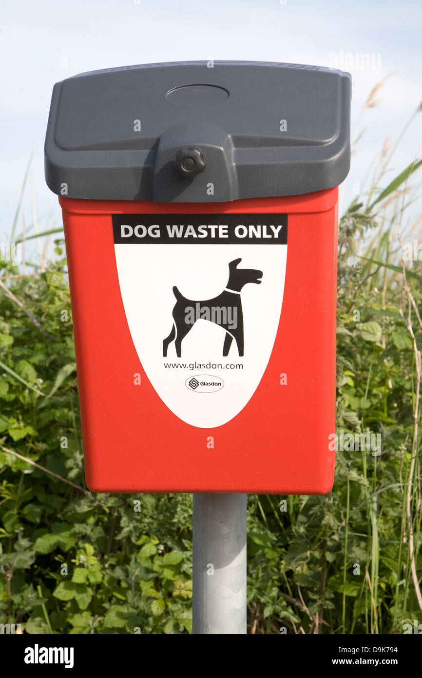Red bin for dog waste only Stock Photo