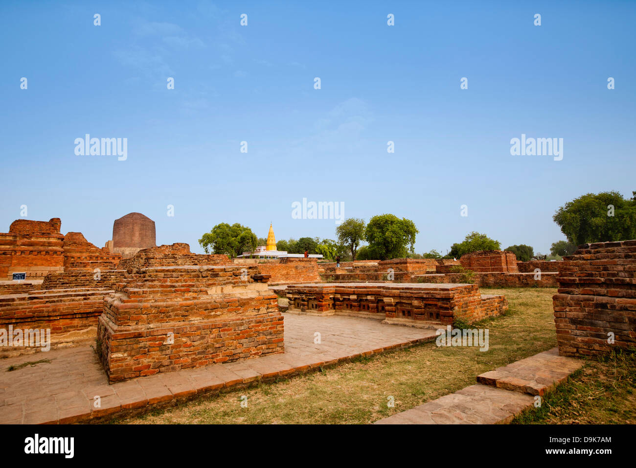 Ruins with stupa in background, Sarnath, Varanasi, Uttar Pradesh, India Stock Photo