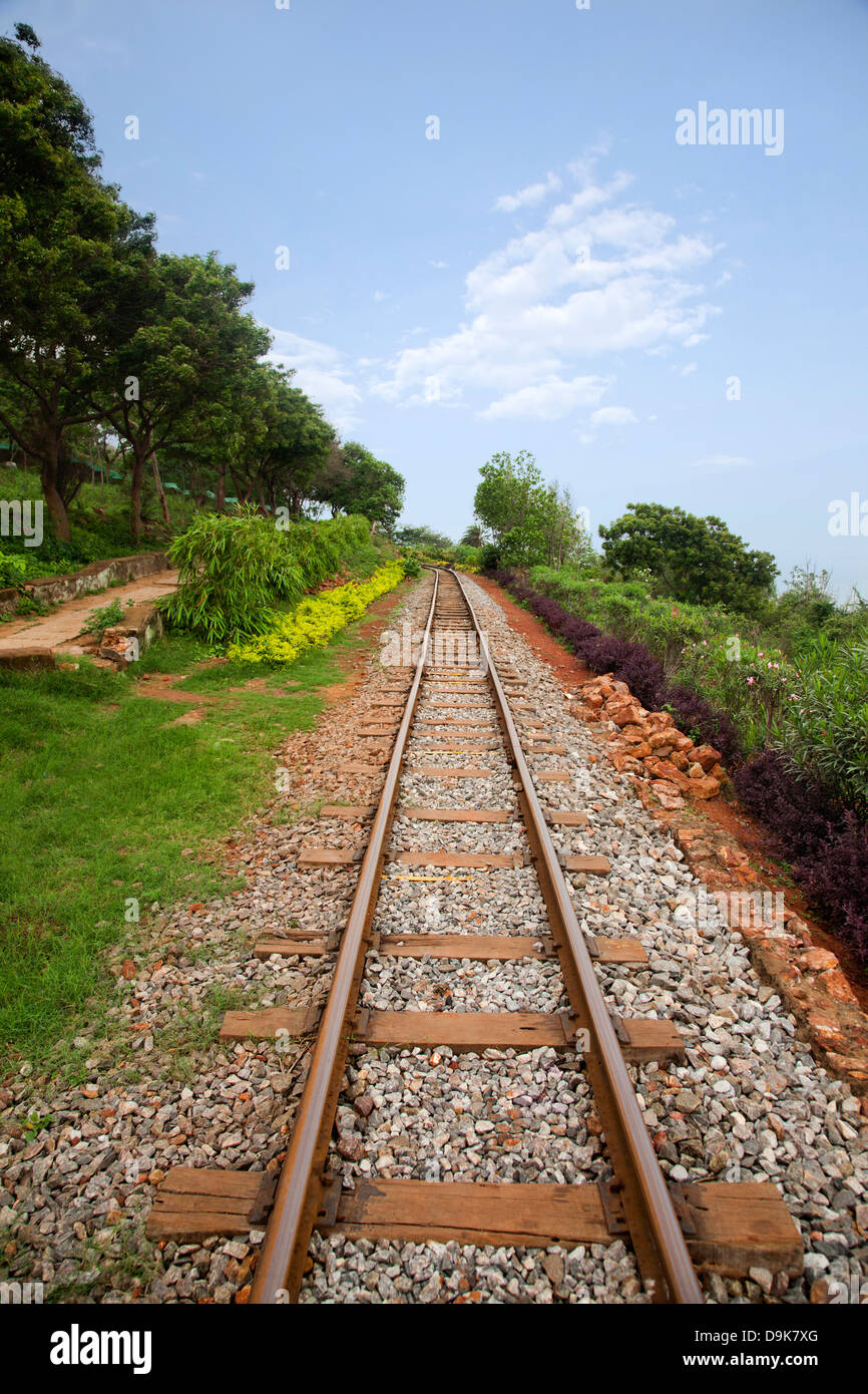 Railroad track passing through a landscape, Visakhapatnam, Andhra Pradesh, India Stock Photo