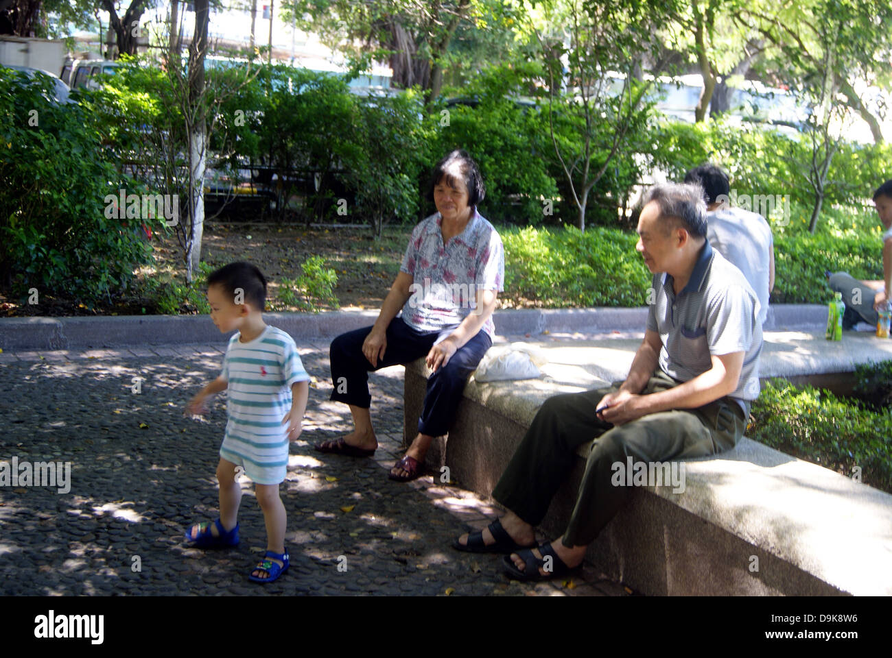 Shenzhen China: children, older people in the road green belts and leisure Stock Photo