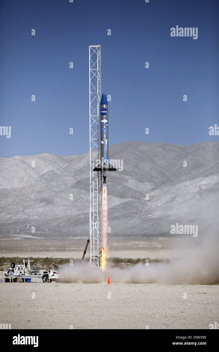 The Garvey Spacecraft Corporation's Prospector P-18D rocket lifts off carrying the RUBICS-1 payload on a high-altitude suborbital flight June 15, 2013. The rocket parachute deployed early causing the rocket to return to earth. The purpose of the NASA-sponsored mission was to test the CubeSats under flight conditions at high altitudes to see if they're ready to launch into orbit next year. Stock Photo