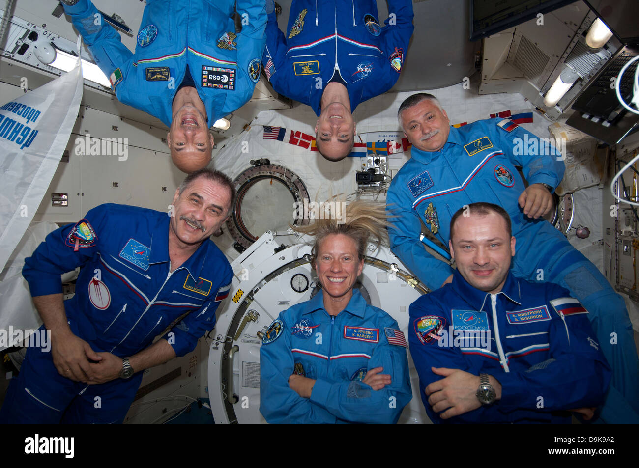 Floating inside the Kibo laboratory in the International Space Station, the six Expedition 36 crew members videotape a tribute to cosmonaut Valentina Tereshkova, who on June 16 will mark the 50th anniversary of her 1963 launch aboard the Soviet Vostok-6 spacecraft June 8, 2013. On the bottom row from left are Expedition 36 Commander Pavel Vinogradov of Russia's Federal Space Agency and Flight Engineers Karen Nyberg of NASA and Alexander Misurkin of Roscosmos. On top are from left Flight Engineers Luca Parmitano of the ESA, Chris Cassidy of NASA and Fyodor Yurchikhin of Roscosmos. Stock Photo