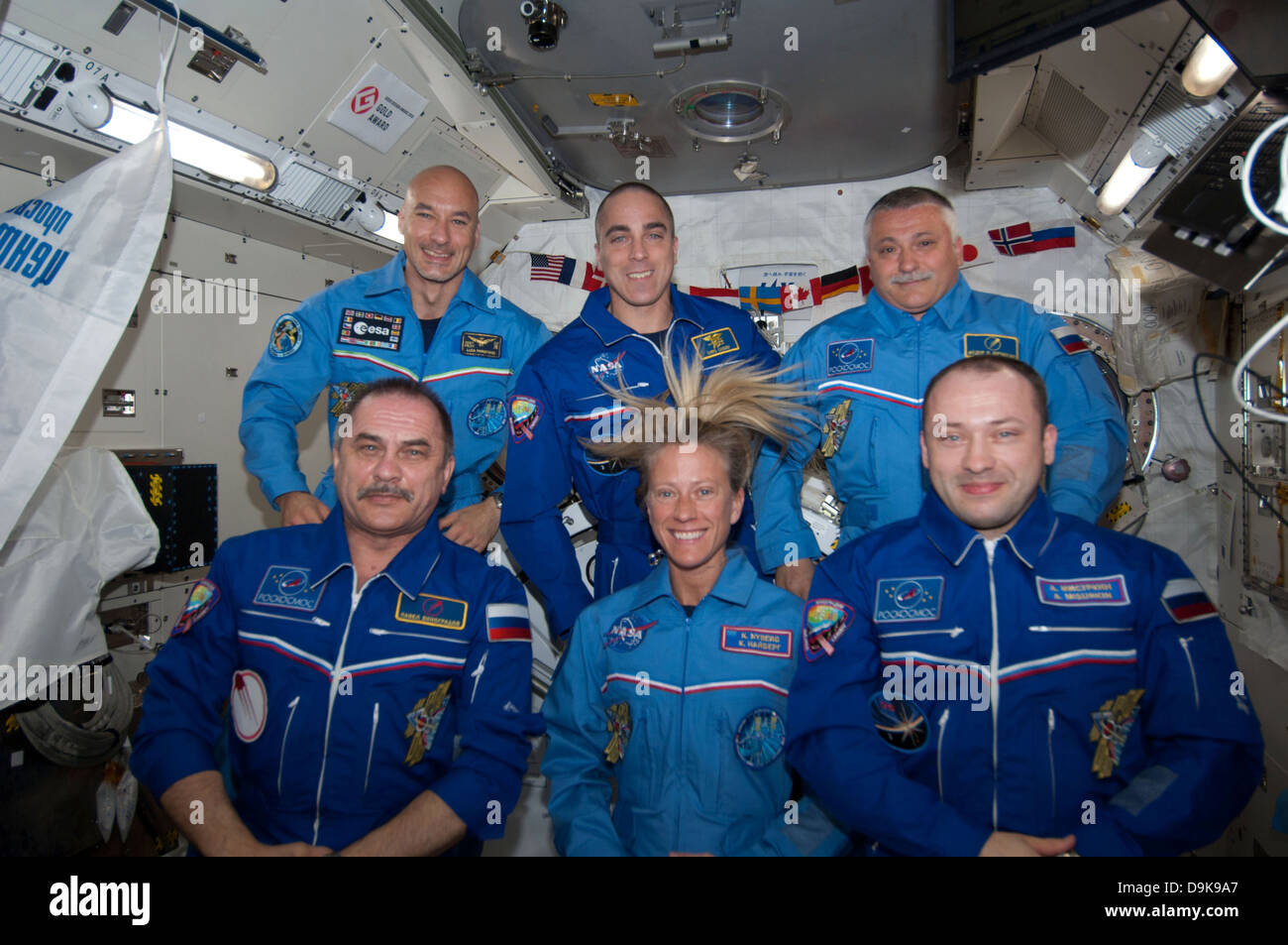 Floating inside the Kibo laboratory in the International Space Station, the six Expedition 36 crew members videotape a tribute to cosmonaut Valentina Tereshkova, who on June 16 will mark the 50th anniversary of her 1963 launch aboard the Soviet Vostok-6 spacecraft June 8, 2013. On the bottom row from left are Expedition 36 Commander Pavel Vinogradov of Russia's Federal Space Agency and Flight Engineers Karen Nyberg of NASA and Alexander Misurkin of Roscosmos. On top are from left Flight Engineers Luca Parmitano of the ESA, Chris Cassidy of NASA and Fyodor Yurchikhin of Roscosmos. Stock Photo