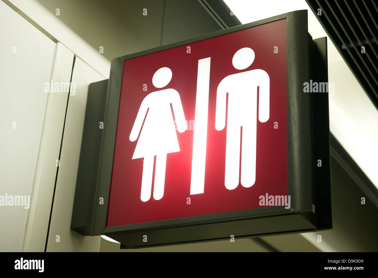 Red toilet sign at the airport in Hong Kong Stock Photo