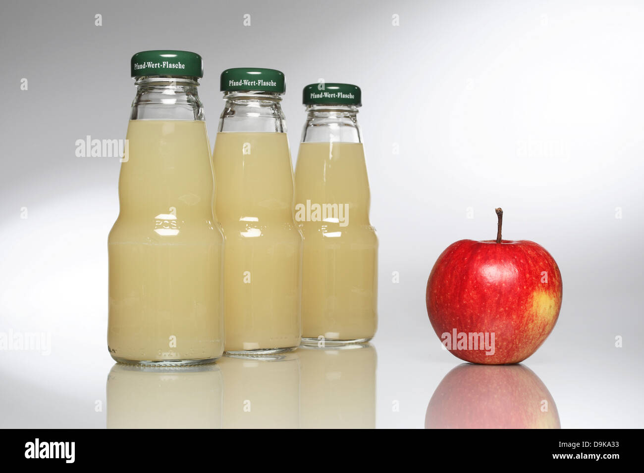 Bottles with apple juice Stock Photo Alamy