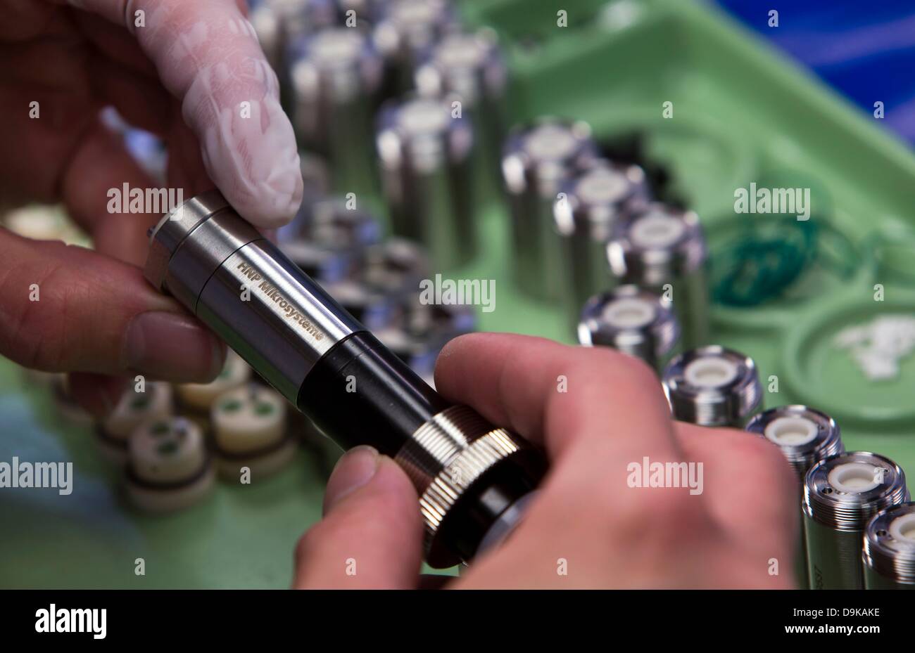 A person fits micro annular gear pumps at the new headquarters of HNP Stock  Photo - Alamy