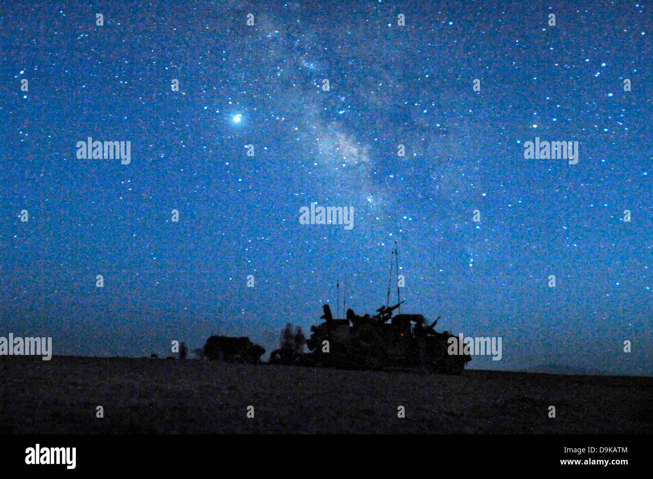 Dutch soldiers settle in for the night under a star filled sky August 19, 2008 in Uruzgan province, Afghanistan. The platoon was on a 3-day International Security Assistance Force mission patrolling through villages. Stock Photo