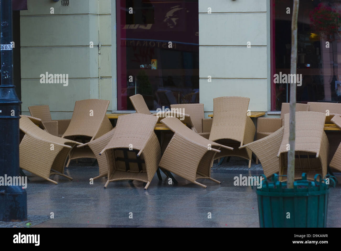 Chairs standing outside the restaurant in the rainy day Stock Photo
