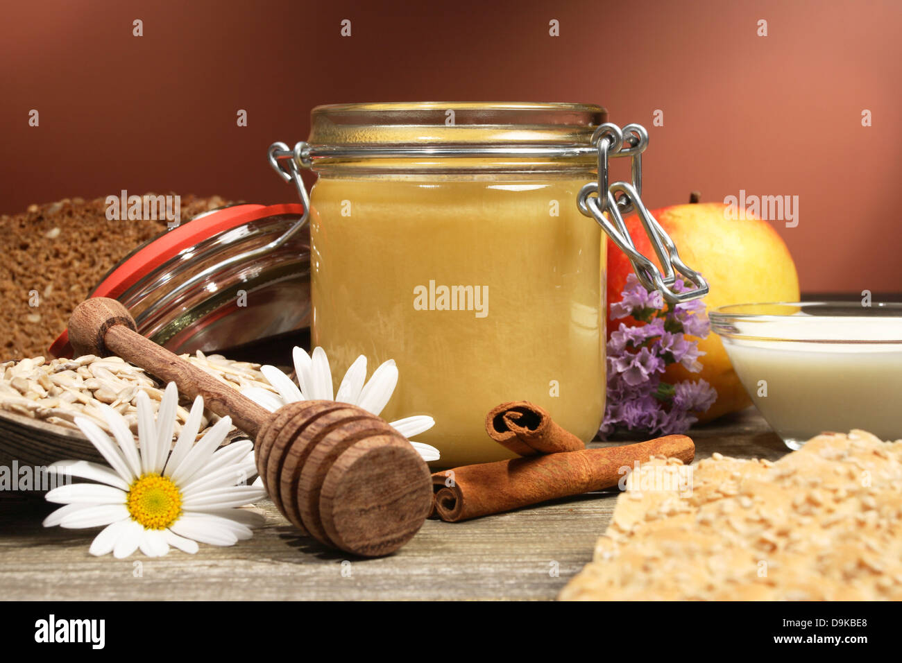 Honey with yoghurt, bread, sunflower cores and cinnamon sticks, Honey