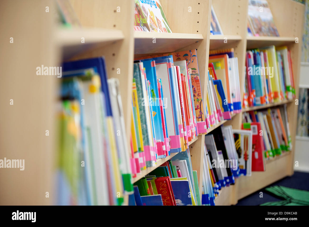 Shelves of books in a primary school library Stock Photo
