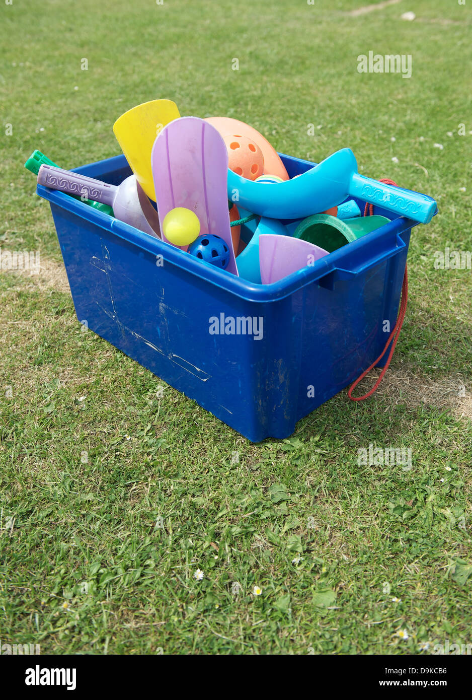 A box of children's play equipment outside on a school field Stock Photo
