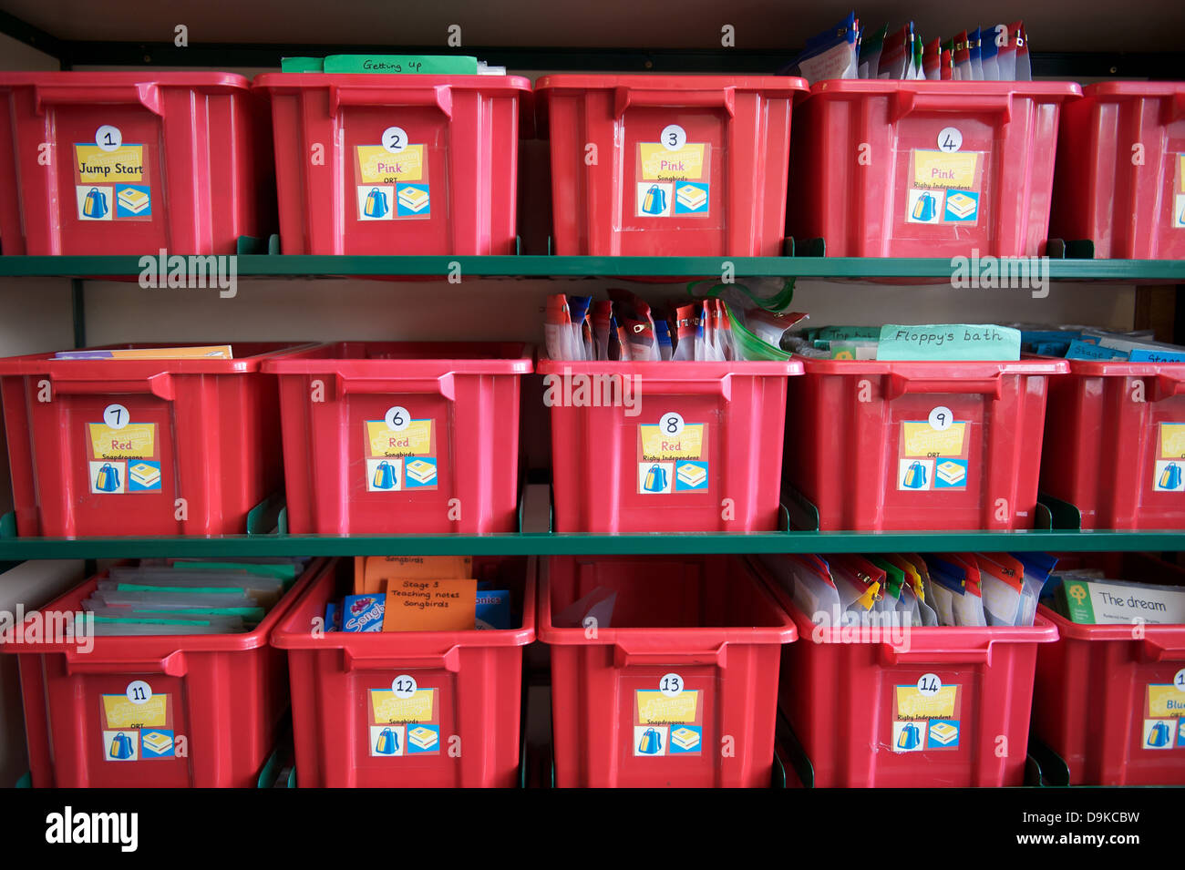 Rows of red storage boxes in a school Stock Photo - Alamy