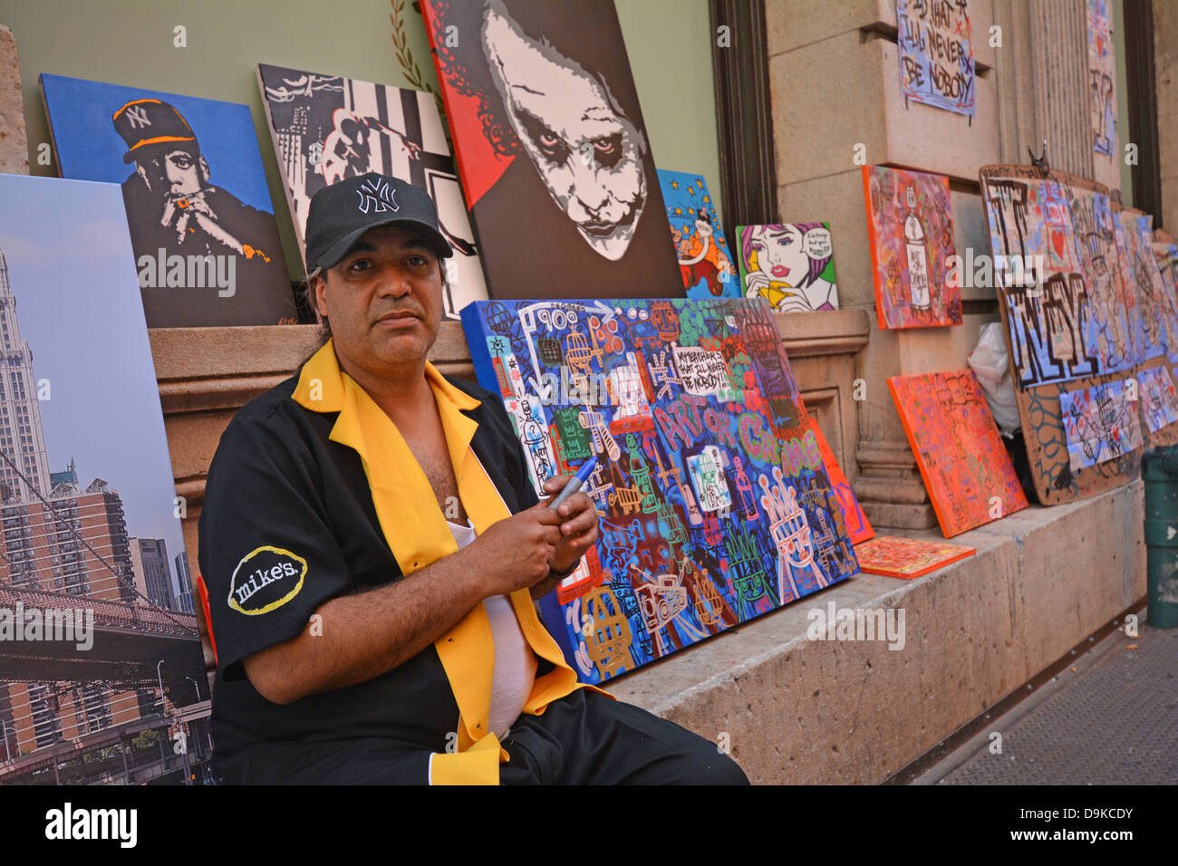 Portrait of graffiti artist Ivan who paints on subway maps and sells to tourists in Soho section of Manhattan, New York City Stock Photo