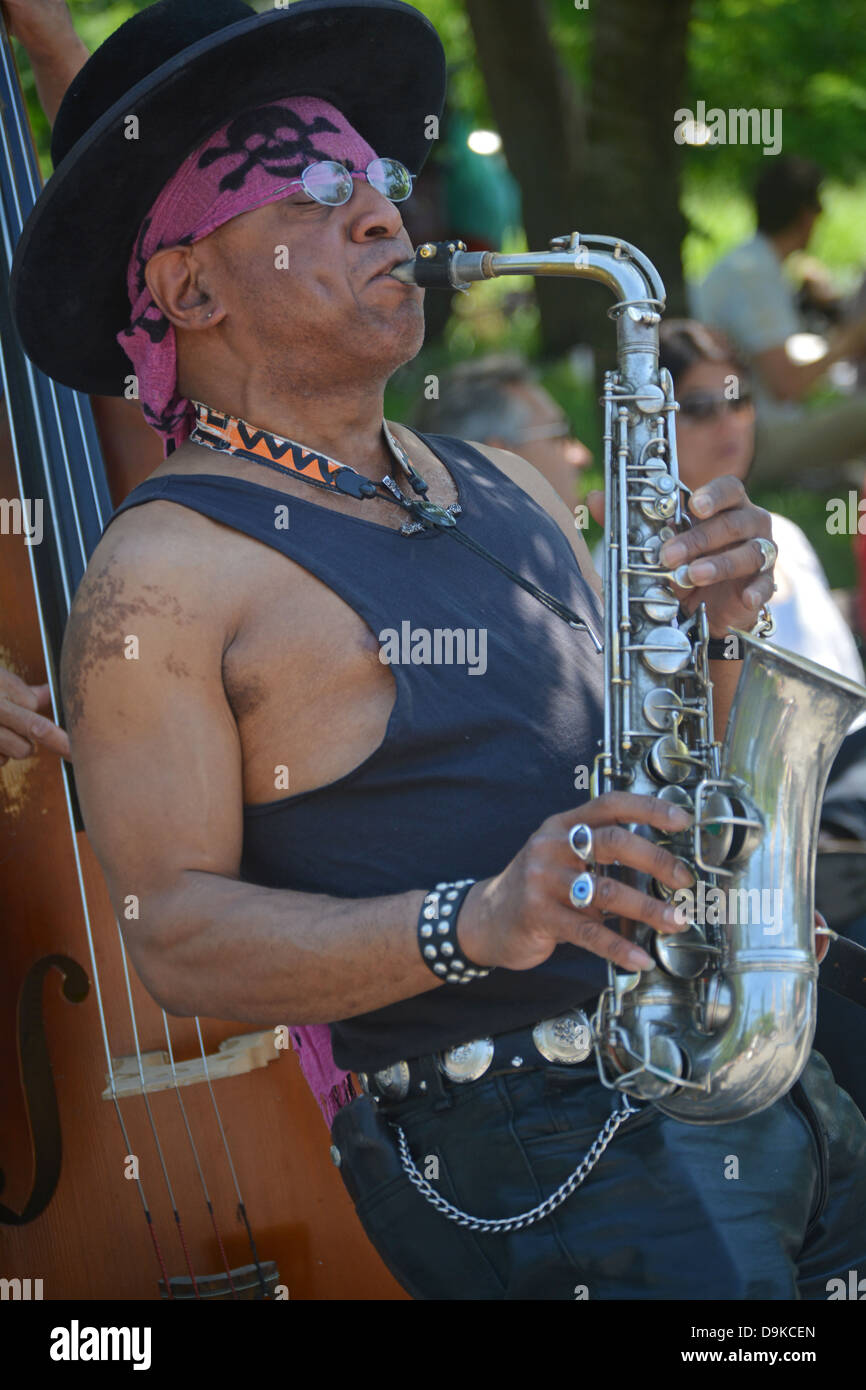Portrait of a street musician playing the saxophone in Washington Square Park in Greenwich Village, New York City Stock Photo