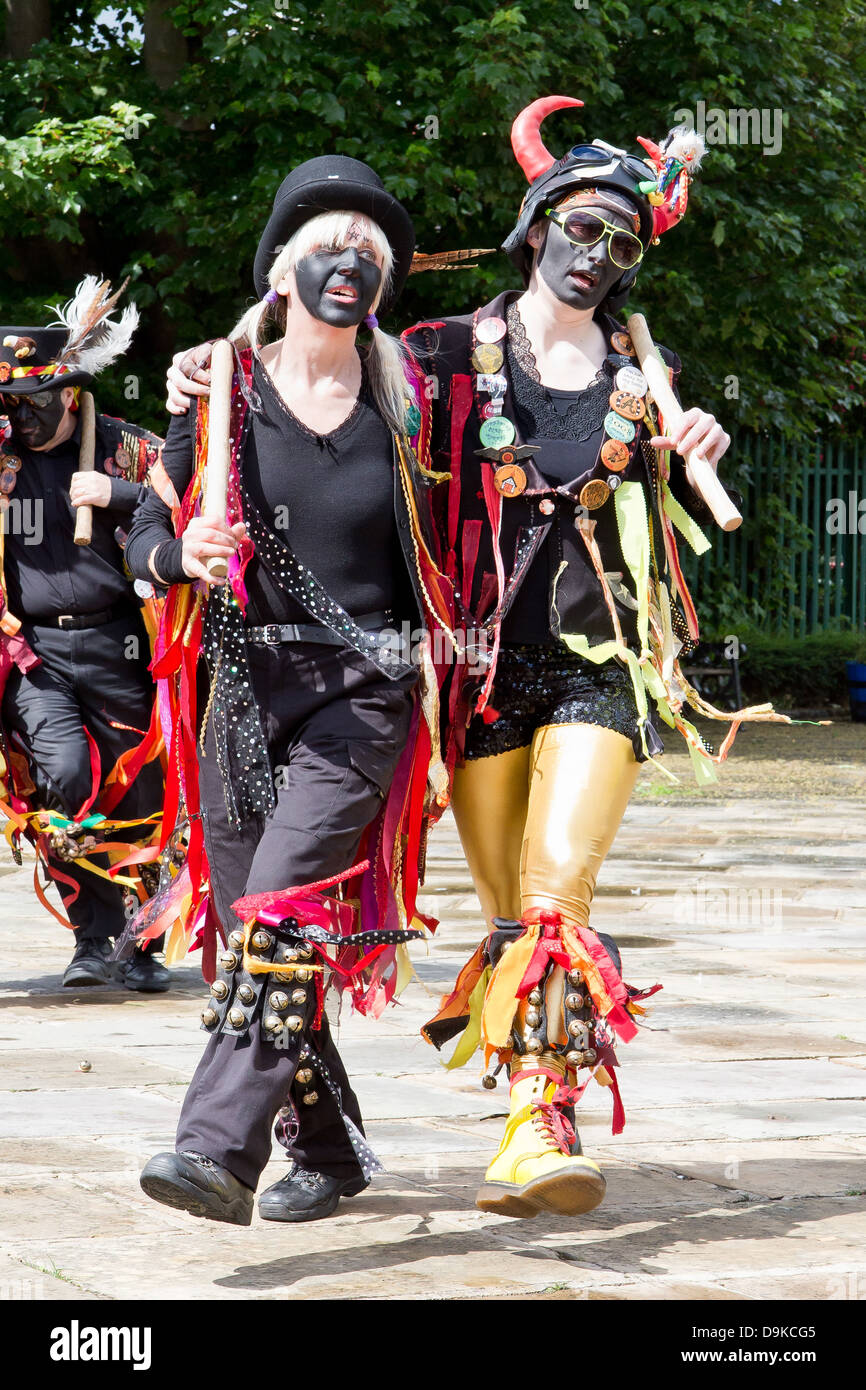 female Morris dancers with black faces at Skipton, north Yorkshire, England Stock Photo