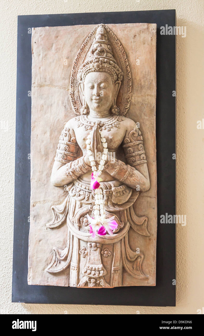 Stone sculpture art of angel benign decorated on wall Stock Photo