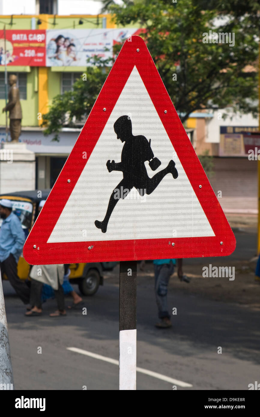 Asia, India, Tamil Nadu, Vellore, a running child on a traffic sign