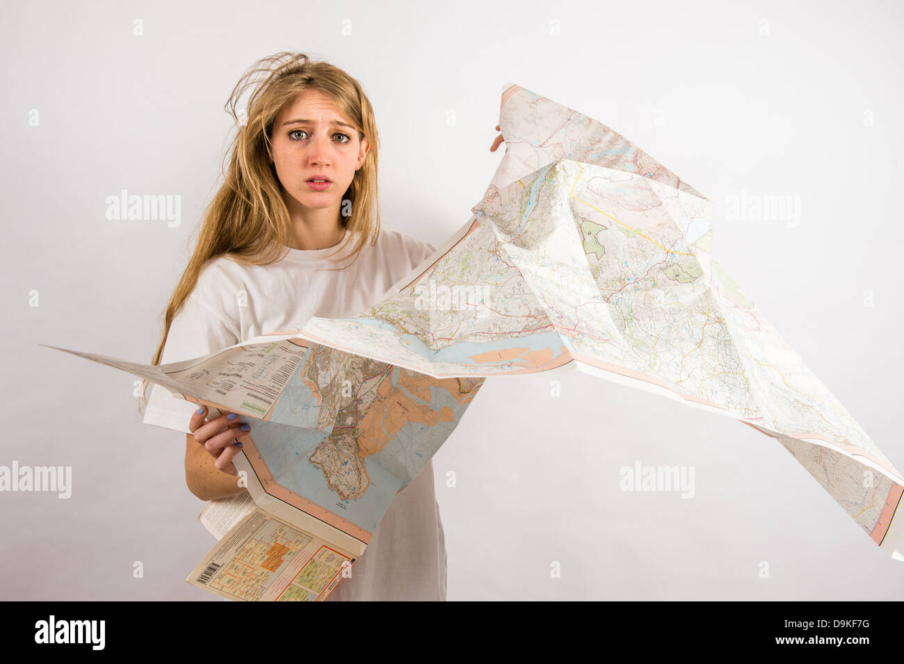 A confused young woman with long blonde hair looking lost and confused holding an Ordnance Survey map, UK Stock Photo - Alamy A confused young woman with long blonde hair looking lost and confused holding an Ordnance Survey map, UK Stock Photo - Alamy