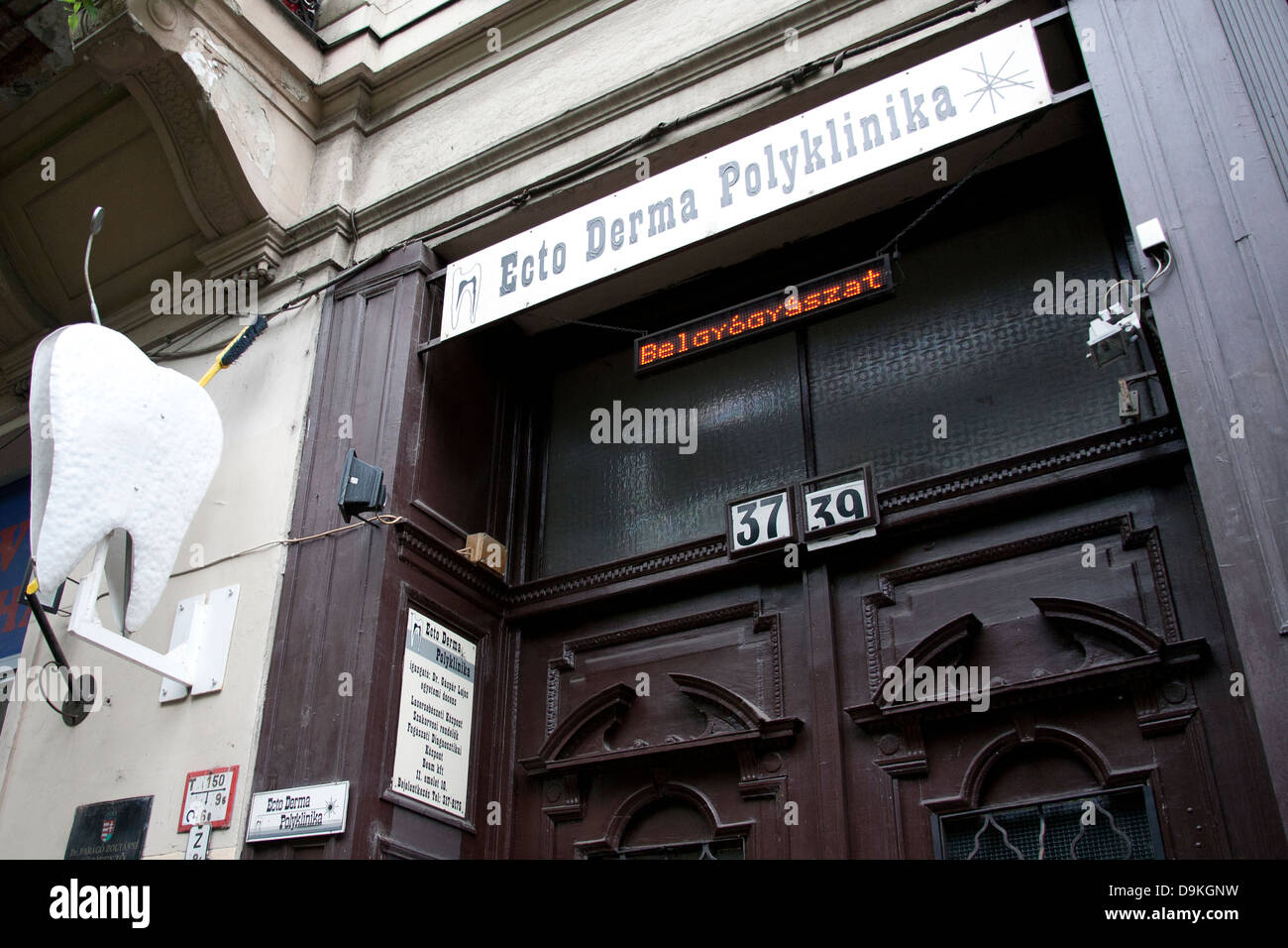 Hungarian dentist tooth advertisement on a shop front Budapest