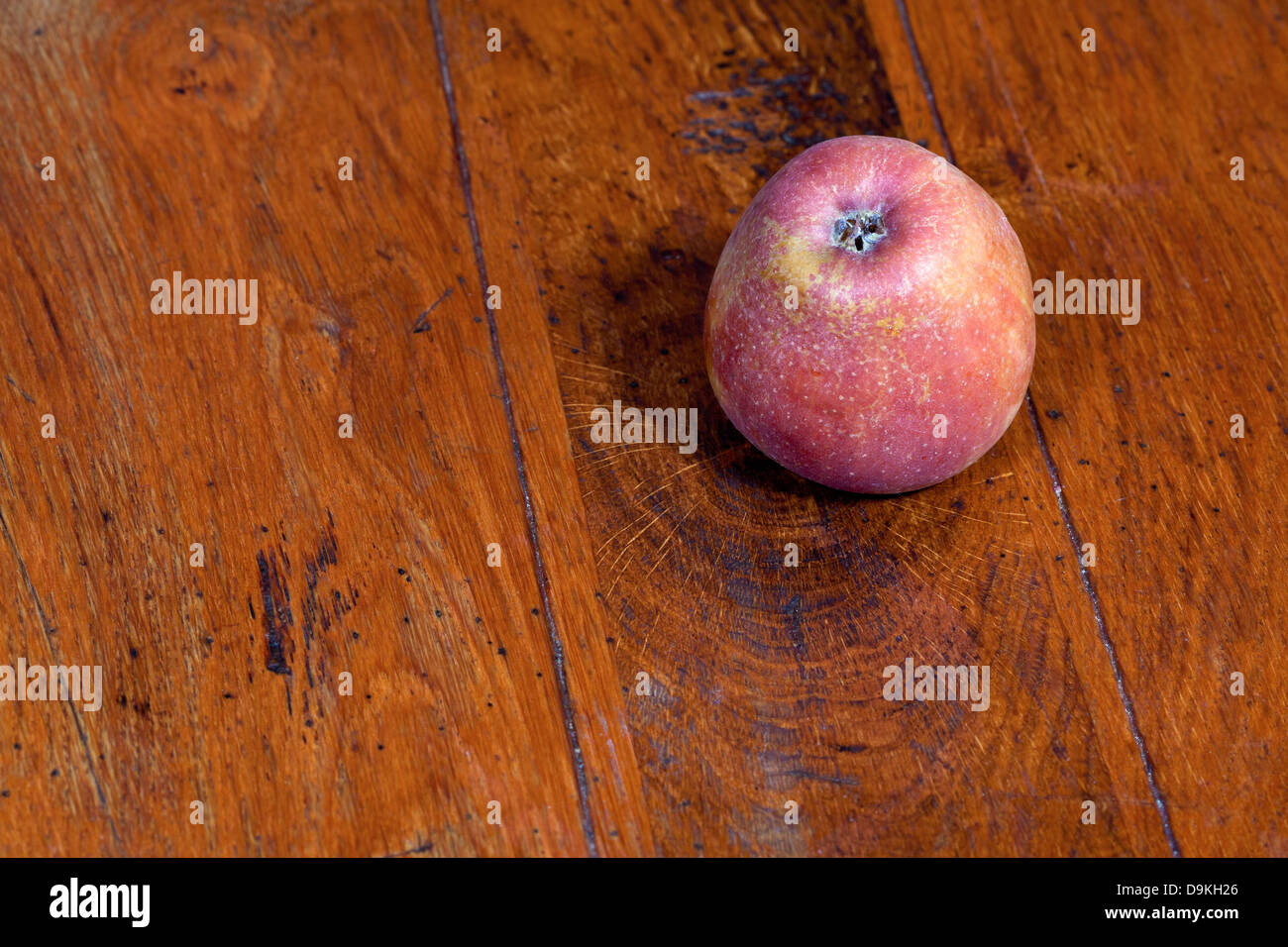 red apple on wooden table Stock Photo