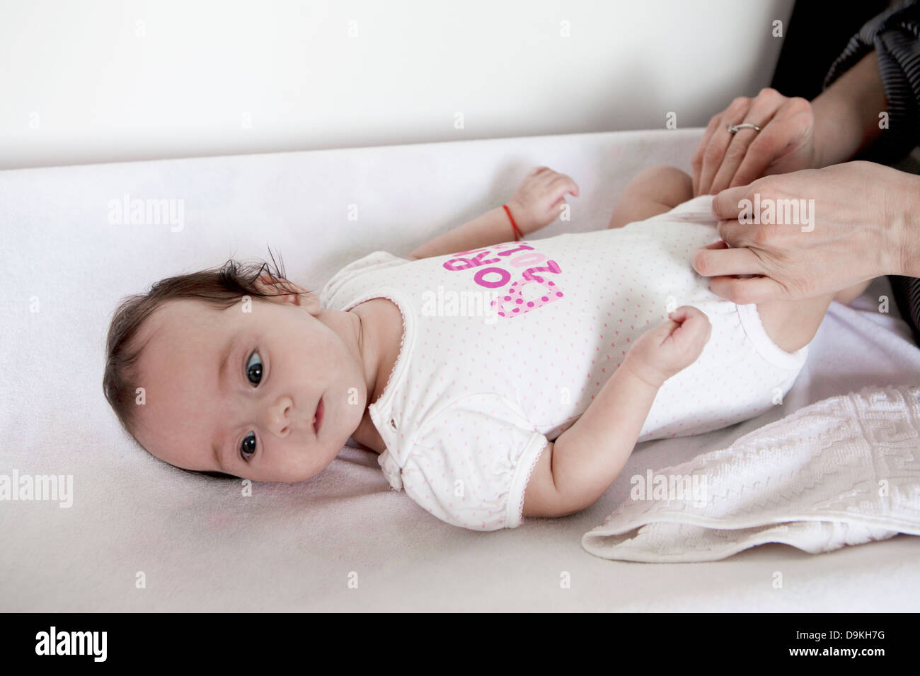 baby girl on the changing table,diaper change Stock Photo Alamy