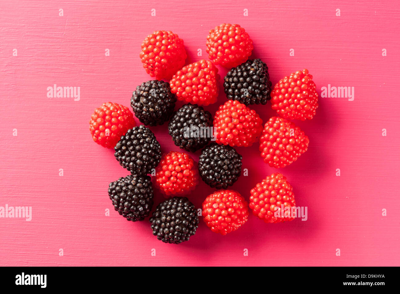 Colorful Sweet Raspberry Candy against a colorful background Stock ...