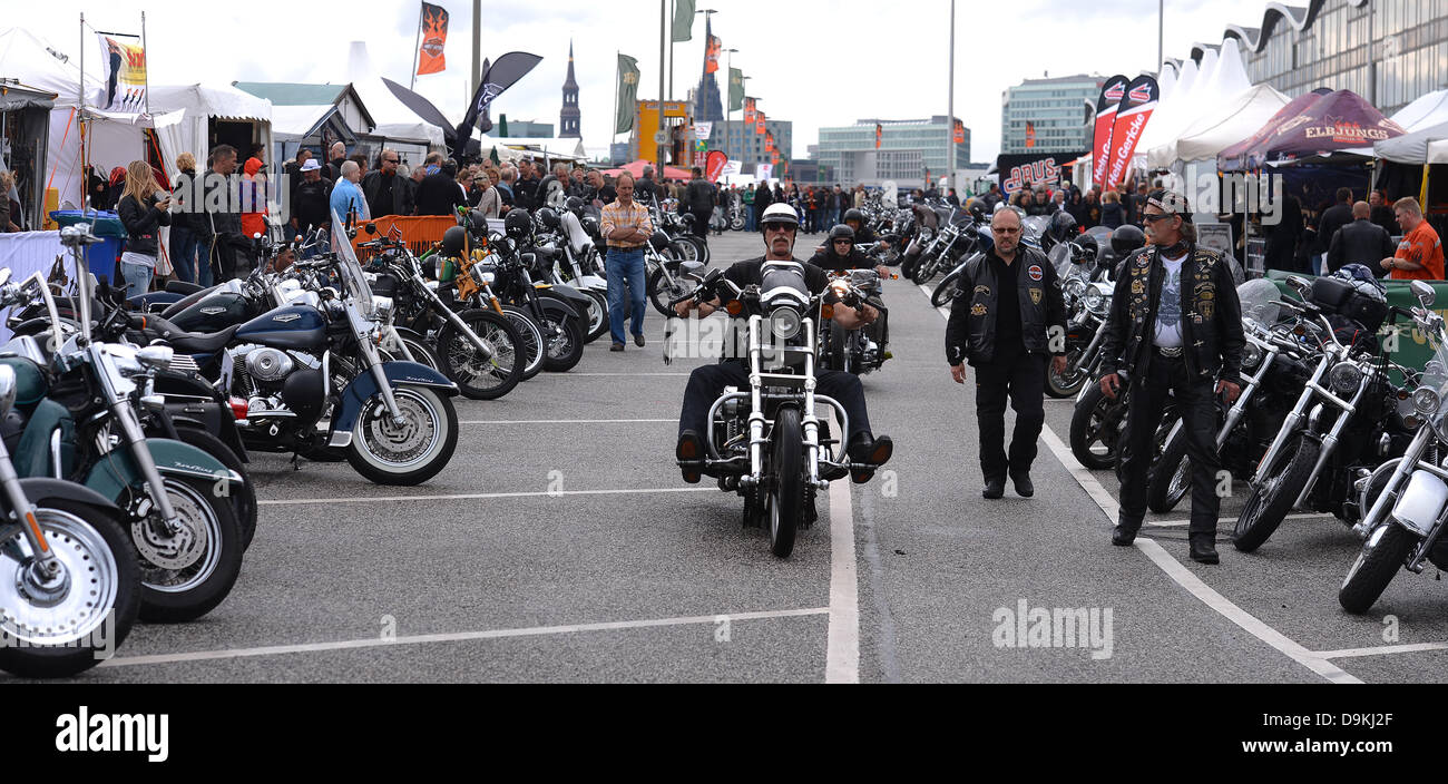 Harley fans drive their motorcycles through the entrance of the Harley Days at the Grossmarkt in Hamburg, Germany, 21 June 2013. The Harley Days takes place from 21 until 23 June 2013. Photo: AXEL HEIMKEN Stock Photo