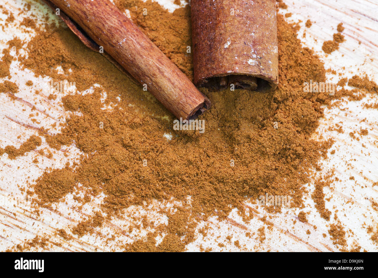 sticks of cinnamon and pinch of ground cinnamon Stock Photo Alamy