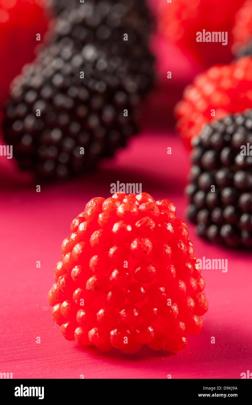 Colorful Sweet Raspberry Candy against a colorful background Stock ...