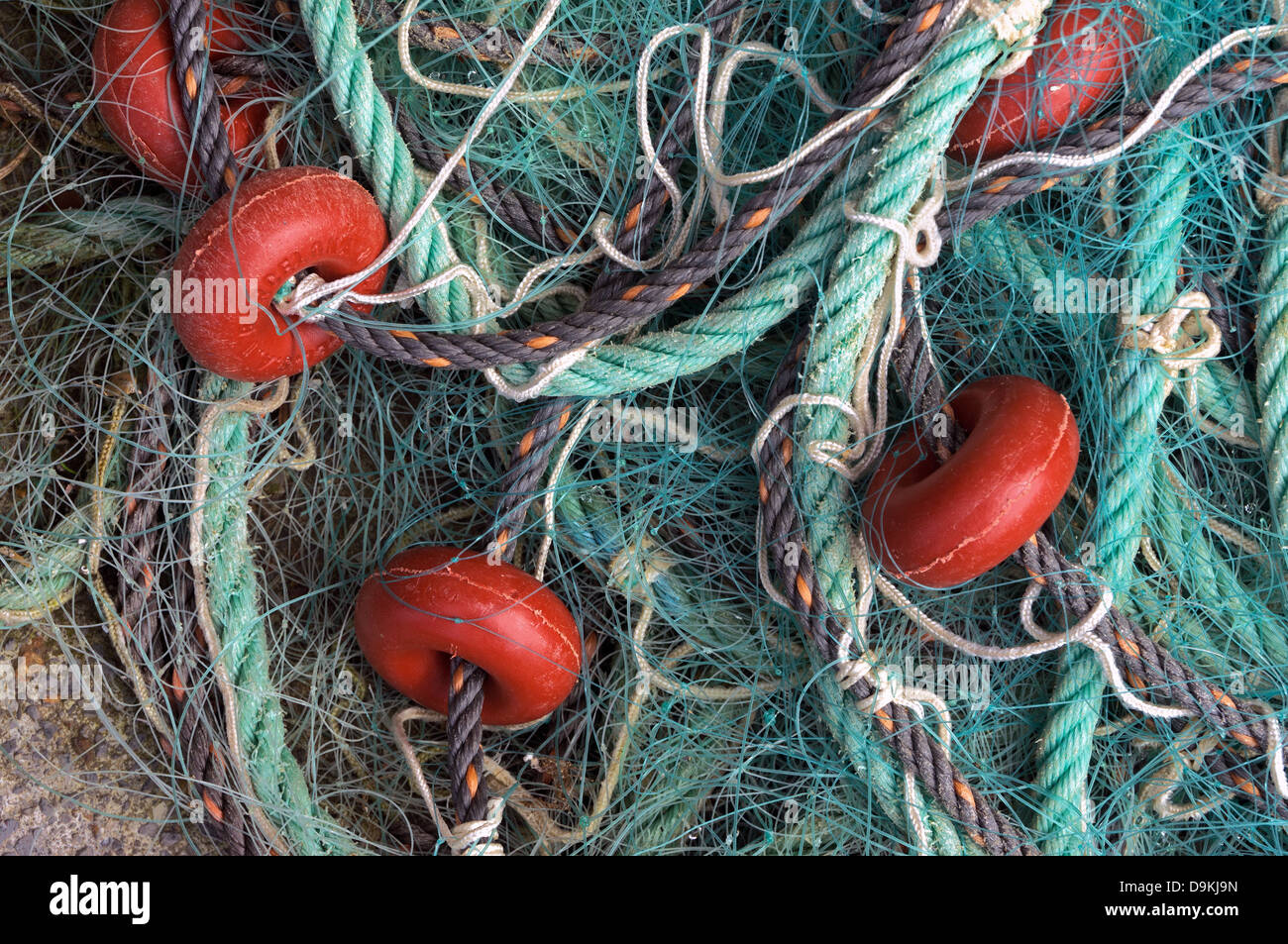 fishing corks in fishing net and a rope Stock Photo - Alamy