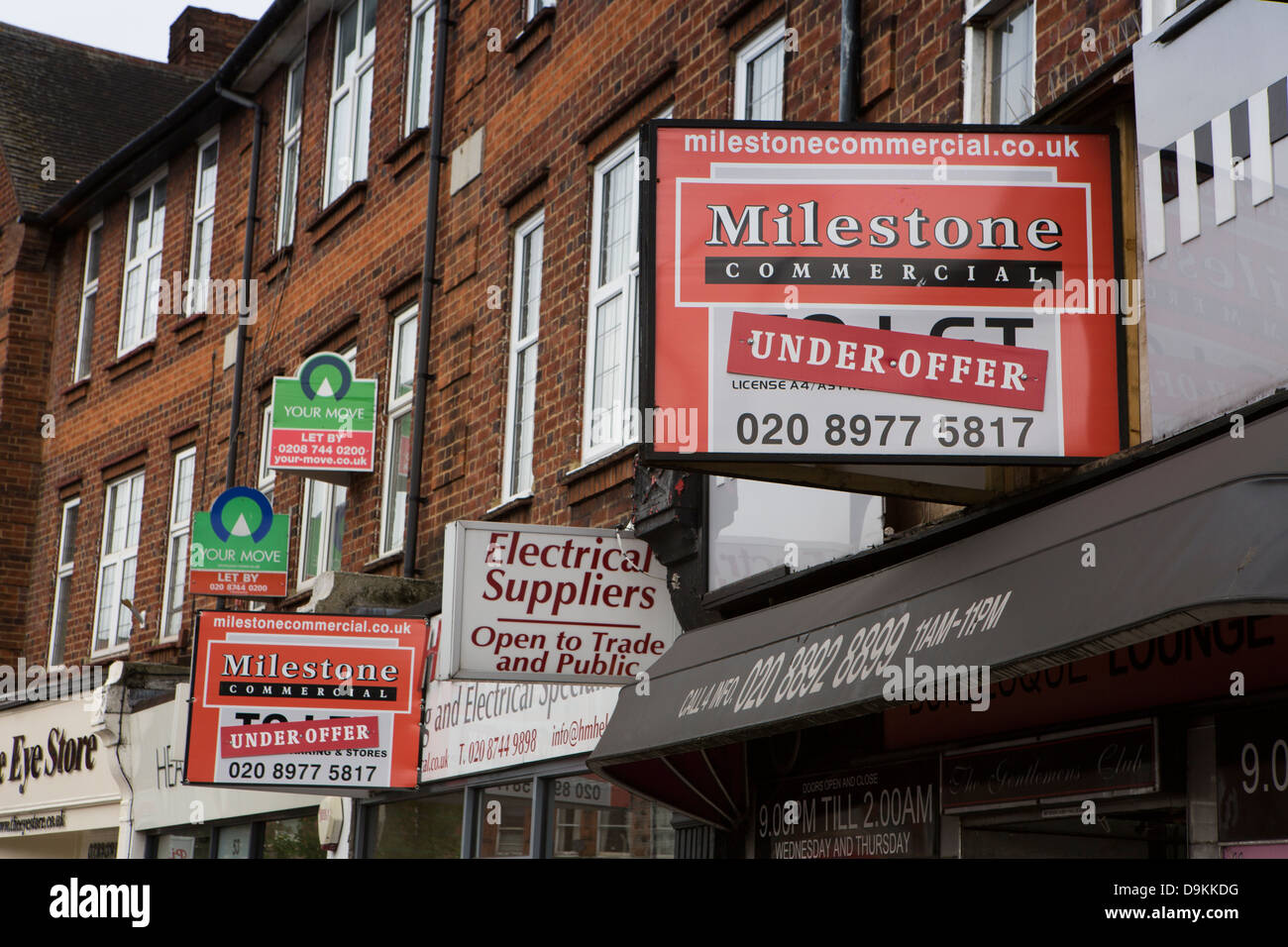 UK, Middlesex, Twickenham, Returning confidence in commercial property market, let by and under offer signs on shops Stock Photo