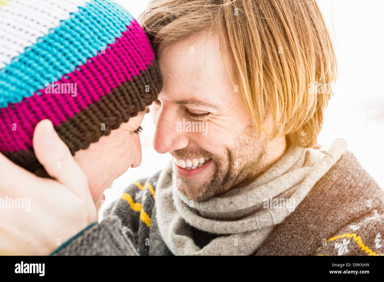 Couple face to face, woman wearing knit hat Stock Photo