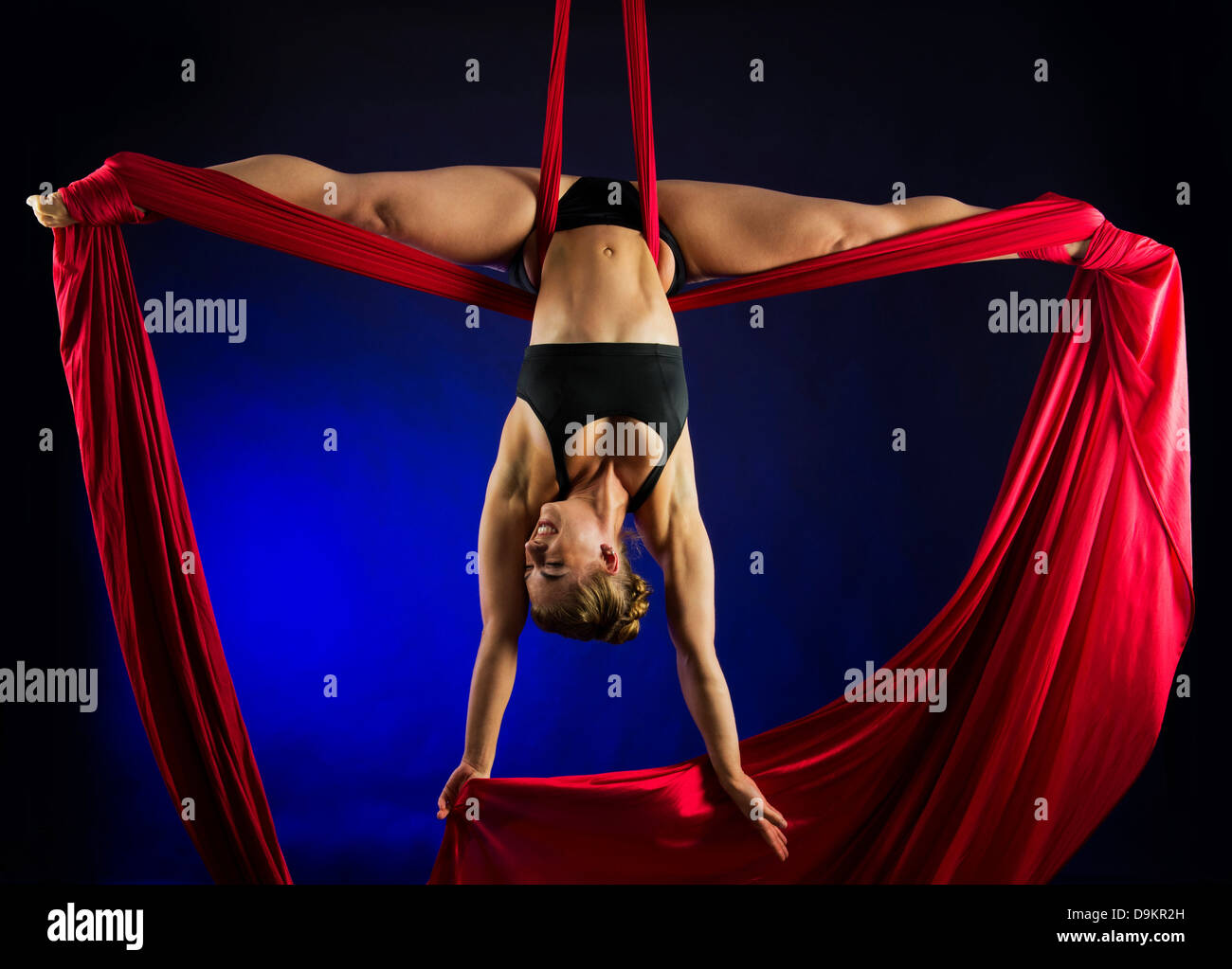 Woman performing acrobatics Stock Photo - Alamy