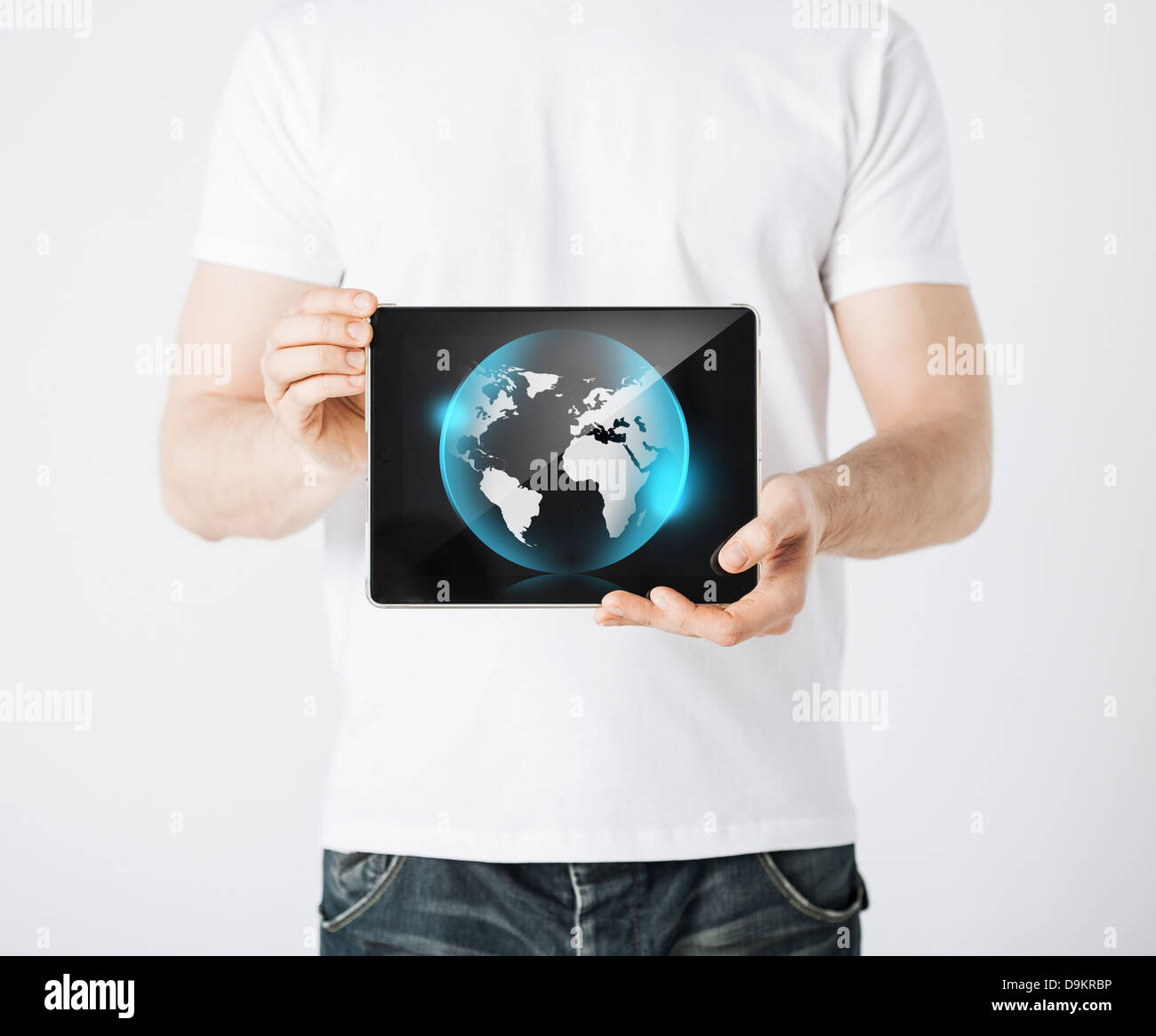 man hands holding tablet pc with sign of globe Stock Photo